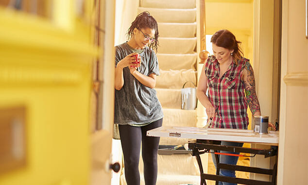 two women working on a home remodel