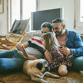 couple at home with daughter and dog