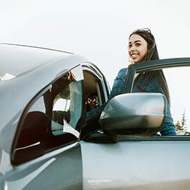 Woman getting into car