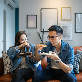 couple eating takeout food at home